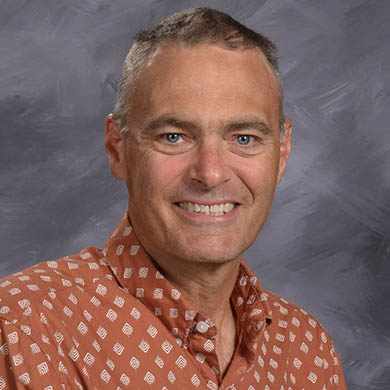 Duane Baker smiling at the camera