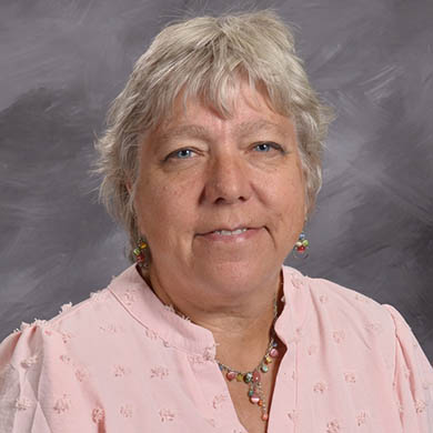 Ruth Busscher smiling at the camera.