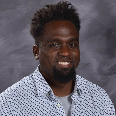 Devon Scott smiling at camera