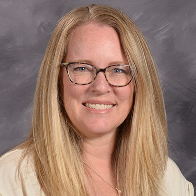 Susan VandenBerg smiling at the camera