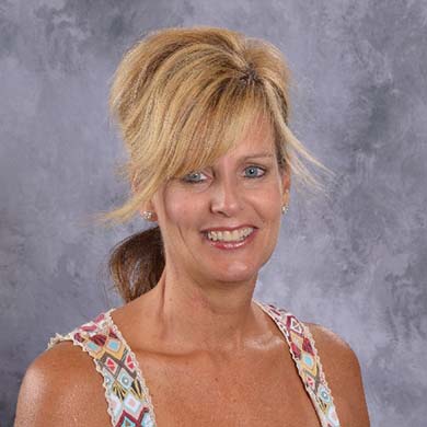 Kim Folkerts smiling at the camera