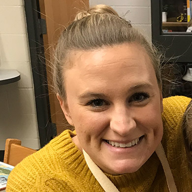 Preschool teacher Allison DeLange smiling at the camera.