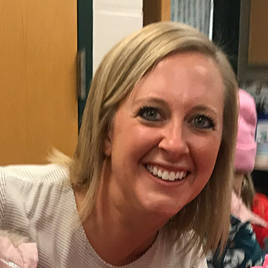 Preschool teacher Laura Rotman smiling at the camera.