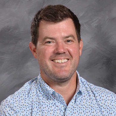 Joe Baillargeon smiling at the camera.