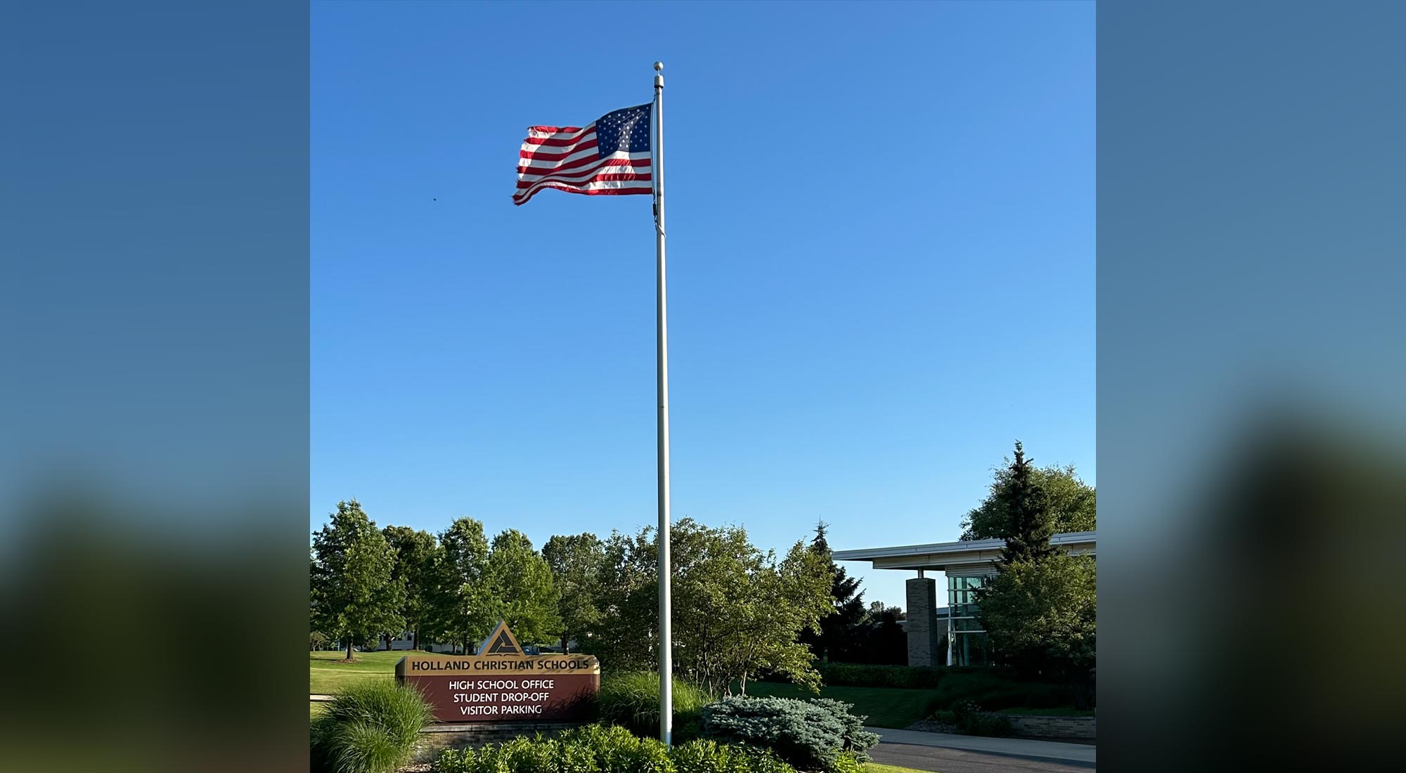 High School Main Entrance sign and American Flag