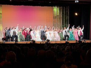 Students on stage for play of Pride and Prejudice