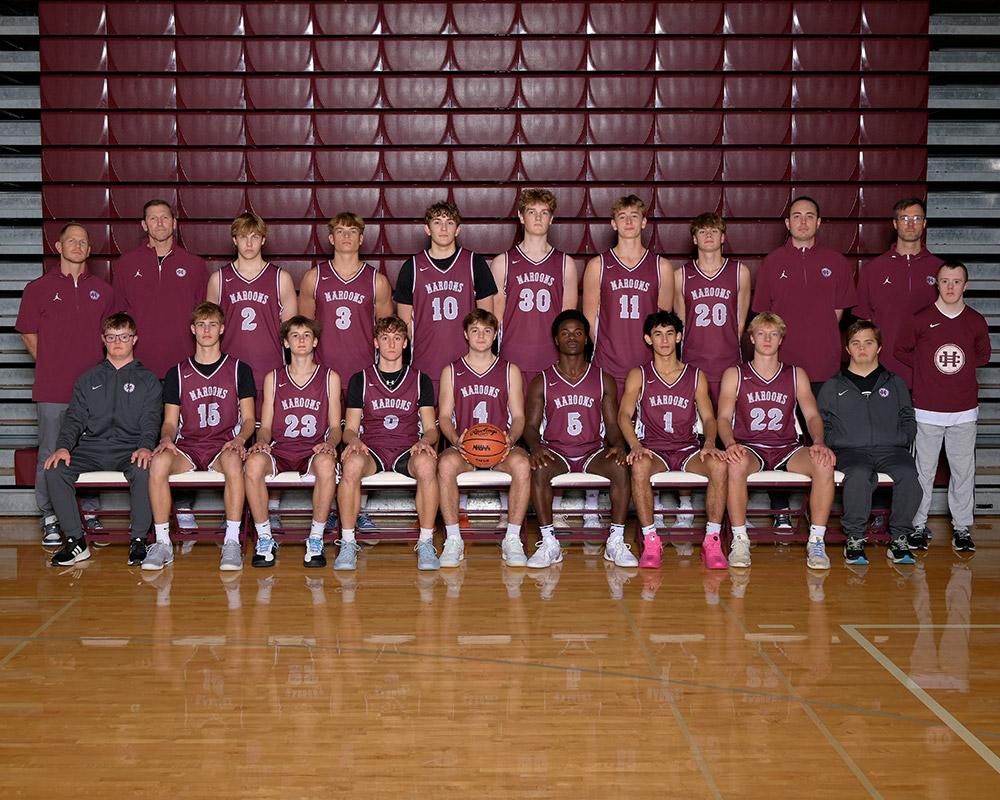 Boys basketball team smiling at the camera