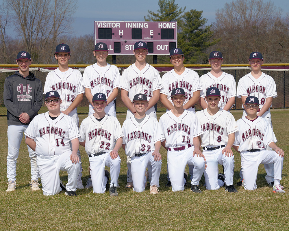 JV baseball team looking at the camera, outside